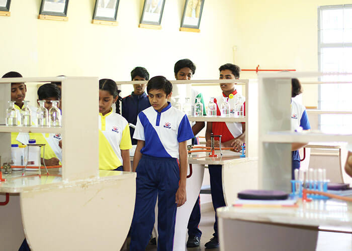Students exploring advanced science lab infrastructure at Galaxy Public School to enhance real-life application-based learning.