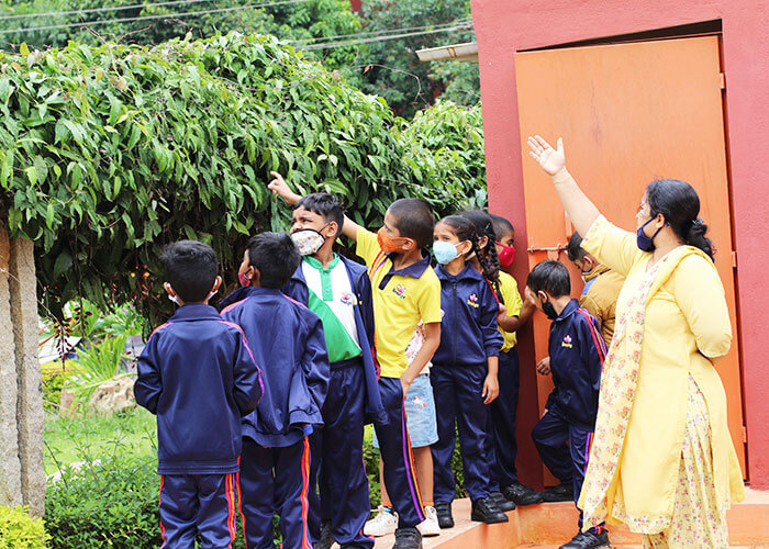 Students engaging in outdoor concept-based learning activities at Galaxy Public School, focusing on deeper understanding and practical insights.
